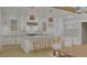 Modern white kitchen with gold accents, large island, and breakfast bar at 420 Greenwich St, Mount Pleasant, SC 29464