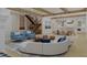 Open living area with curved sofa and blue accent chairs at 420 Greenwich St, Mount Pleasant, SC 29464