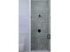 Modern shower with herringbone tile, frameless door, and black matte fixtures at 420 Greenwich St, Mount Pleasant, SC 29464