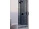 Modern shower with gray tile and glass enclosure at 420 Greenwich St, Mount Pleasant, SC 29464