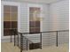 Open staircase with modern metal railing and a geometric light fixture at 420 Greenwich St, Mount Pleasant, SC 29464