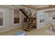 Modern floating staircase with wood treads and metal railing at 420 Greenwich St, Mount Pleasant, SC 29464