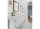White bathroom with a single vanity and a window at 507 Mccants Dr, Mount Pleasant, SC 29464