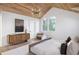 Bright bedroom with hardwood floors and wood media console at 507 Mccants Dr, Mount Pleasant, SC 29464