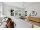 Bright bedroom with a king-size bed, ample natural light, and direct backyard access at 507 Mccants Dr, Mount Pleasant, SC 29464