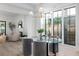 Bright dining area with glass table and chairs, hardwood floors at 507 Mccants Dr, Mount Pleasant, SC 29464