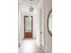 Light and airy entryway with hardwood floors and wood door at 507 Mccants Dr, Mount Pleasant, SC 29464