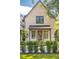 Tan brick home with a front porch and manicured hedges at 507 Mccants Dr, Mount Pleasant, SC 29464