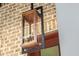 Copper and black lantern hanging on brick wall at 507 Mccants Dr, Mount Pleasant, SC 29464