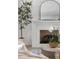 Modern fireplace with white mantel and orchids at 507 Mccants Dr, Mount Pleasant, SC 29464