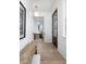 Welcoming foyer with hardwood floors, shiplap walls, and a wooden bench at 507 Mccants Dr, Mount Pleasant, SC 29464