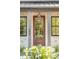 Exterior view of a home with a wood front door and brick facade at 507 Mccants Dr, Mount Pleasant, SC 29464