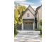 Two-car garage with gray doors and paver driveway at 507 Mccants Dr, Mount Pleasant, SC 29464