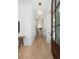 Light-filled hallway with hardwood floors, leading to living area at 507 Mccants Dr, Mount Pleasant, SC 29464