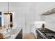 White kitchen with marble countertops and a large island at 507 Mccants Dr, Mount Pleasant, SC 29464