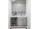 Laundry room with gray cabinets, quartz countertops and a beverage refrigerator at 507 Mccants Dr, Mount Pleasant, SC 29464