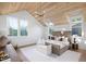 Main bedroom with vaulted ceiling, hardwood floors, and large windows at 507 Mccants Dr, Mount Pleasant, SC 29464