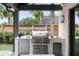 Stainless steel outdoor kitchen with built-in appliances at 507 Mccants Dr, Mount Pleasant, SC 29464