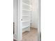 Walk-in pantry with white shelving and light wood floors at 507 Mccants Dr, Mount Pleasant, SC 29464