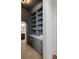 Gray pantry with white quartz countertops, wine cooler, and ample shelving at 507 Mccants Dr, Mount Pleasant, SC 29464