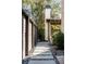 Stone pathway beside a wooden fence leads to backyard at 507 Mccants Dr, Mount Pleasant, SC 29464