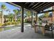 Outdoor patio with dining area, pool view, and built-in grill at 507 Mccants Dr, Mount Pleasant, SC 29464