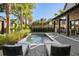 Modern rectangular pool with lounge chairs and tropical landscaping at 507 Mccants Dr, Mount Pleasant, SC 29464