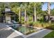 Inviting rectangular pool with brick patio, fire pit, and landscaping at 507 Mccants Dr, Mount Pleasant, SC 29464