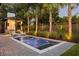 Inviting rectangular pool with brick patio and lush landscaping at 507 Mccants Dr, Mount Pleasant, SC 29464