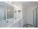 Bright bathroom boasts double sinks, a large mirror, and a separate shower at 553 Trotters Ln, Moncks Corner, SC 29461