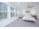 Serene bedroom with a queen-size bed, grey carpet, and ample natural light at 553 Trotters Ln, Moncks Corner, SC 29461