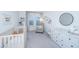 Bedroom with crib, armchair, dresser, and window at 553 Trotters Ln, Moncks Corner, SC 29461