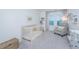 Bedroom features a crib, armchair, and dresser at 553 Trotters Ln, Moncks Corner, SC 29461