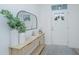 Light and spacious entryway with console table, mirror, and white door at 553 Trotters Ln, Moncks Corner, SC 29461