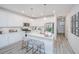 Modern kitchen with white cabinets, stainless steel appliances, and quartz countertops at 553 Trotters Ln, Moncks Corner, SC 29461