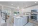 Modern kitchen with white cabinets, stainless steel appliances, and quartz countertops at 553 Trotters Ln, Moncks Corner, SC 29461