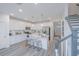 Modern white kitchen with island and stainless steel appliances at 553 Trotters Ln, Moncks Corner, SC 29461