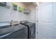 Laundry room with washer, dryer, and shelving at 553 Trotters Ln, Moncks Corner, SC 29461