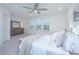 Bright bedroom with large windows, ceiling fan and carpeted floors at 553 Trotters Ln, Moncks Corner, SC 29461