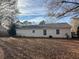 Spacious backyard with mature trees and a partially visible fence at 7640 Hillview Ln, North Charleston, SC 29420