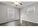 Well-lit bedroom featuring hardwood floors and neutral-toned walls at 7640 Hillview Ln, North Charleston, SC 29420