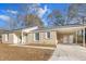 Newly renovated brick ranch home with carport and landscaping at 7640 Hillview Ln, North Charleston, SC 29420
