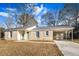 Newly renovated brick ranch home with carport and mature trees at 7640 Hillview Ln, North Charleston, SC 29420