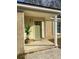 Updated front door and porch with a large potted plant at 7640 Hillview Ln, North Charleston, SC 29420
