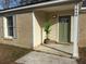 Newly renovated home with a green front door and porch at 7640 Hillview Ln, North Charleston, SC 29420