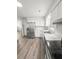 Modern kitchen with stainless steel appliances and white cabinets at 7640 Hillview Ln, North Charleston, SC 29420