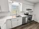 Renovated kitchen, featuring stainless steel appliances and white cabinets at 7640 Hillview Ln, North Charleston, SC 29420