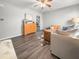Living room with hardwood floors, ceiling fan and open concept to kitchen at 7640 Hillview Ln, North Charleston, SC 29420