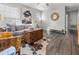 Spacious living room with hardwood floors, large windows, and a comfortable seating area at 7640 Hillview Ln, North Charleston, SC 29420