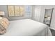 Spacious primary bedroom with large windows and a full-size bed at 7640 Hillview Ln, North Charleston, SC 29420